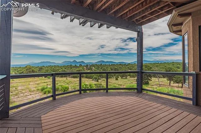 a room with a bed and wooden floor