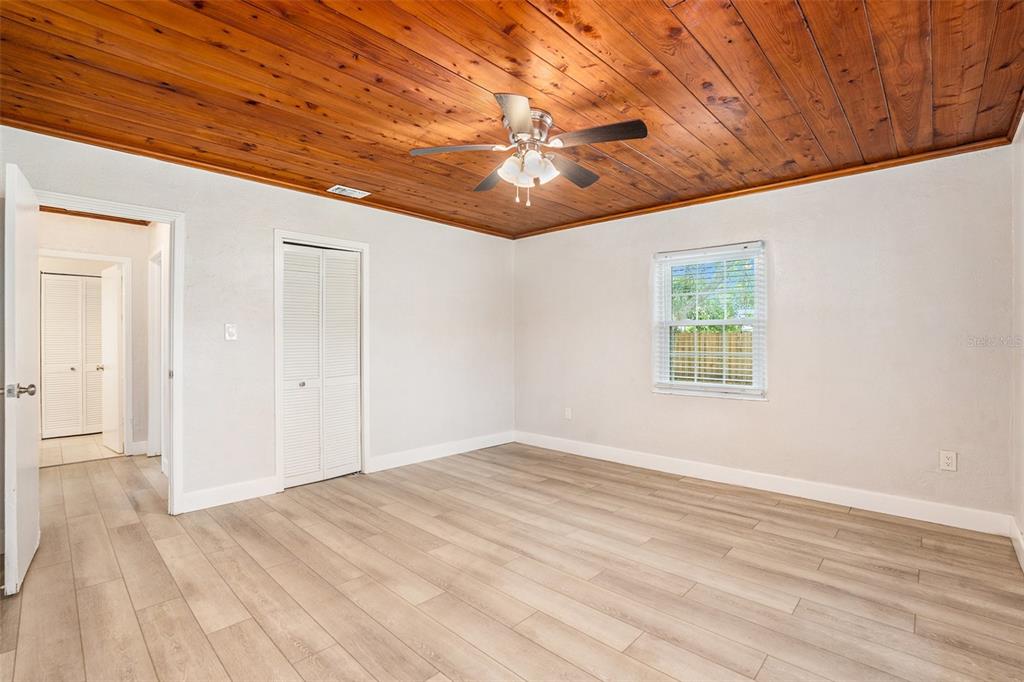 5305 Whiteway Drive Temple Terrace, FL 33617 - Photo 16 of 22 a view of empty room with wooden floor