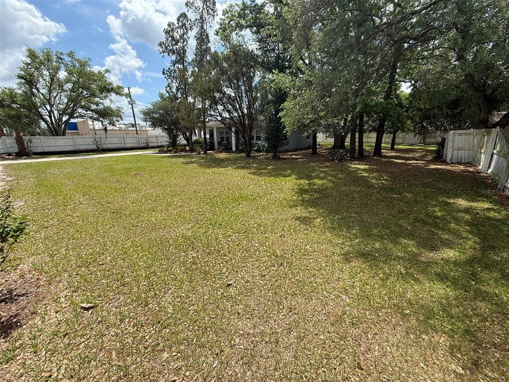 5305 Whiteway Drive Temple Terrace, FL 33617 - Photo 21 of 22 a view of outdoor space with garden and trees