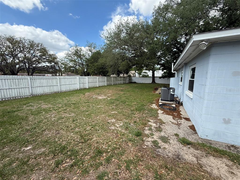 5305 Whiteway Drive Temple Terrace, FL 33617 - Photo 22 of 22 a view of a backyard with a tree