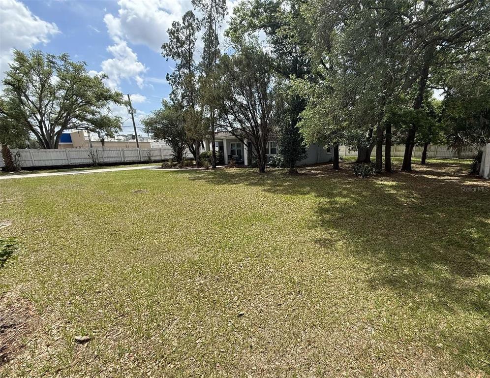 5305 Whiteway Drive Temple Terrace, FL 33617 - Photo 3 of 22 a view of yard with swimming pool and trees
