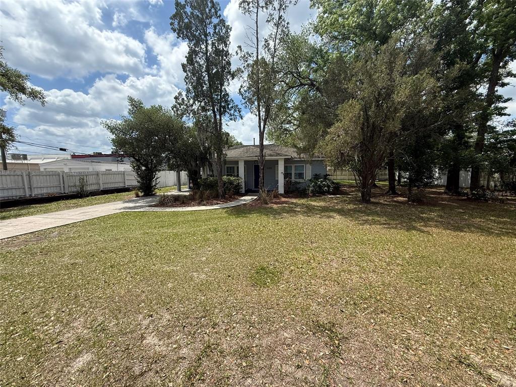5305 Whiteway Drive Temple Terrace, FL 33617 - Photo 4 of 22 a view of a house with a yard