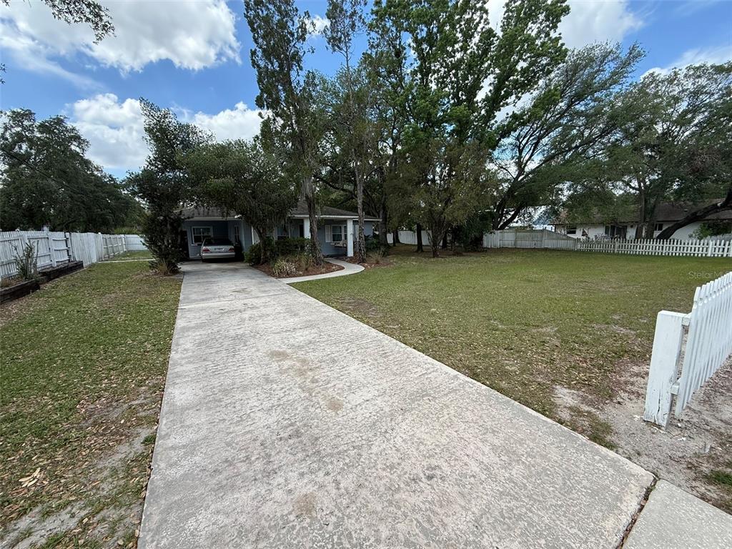 5305 Whiteway Drive Temple Terrace, FL 33617 - Photo 5 of 22 a backyard of a house with lots of green space