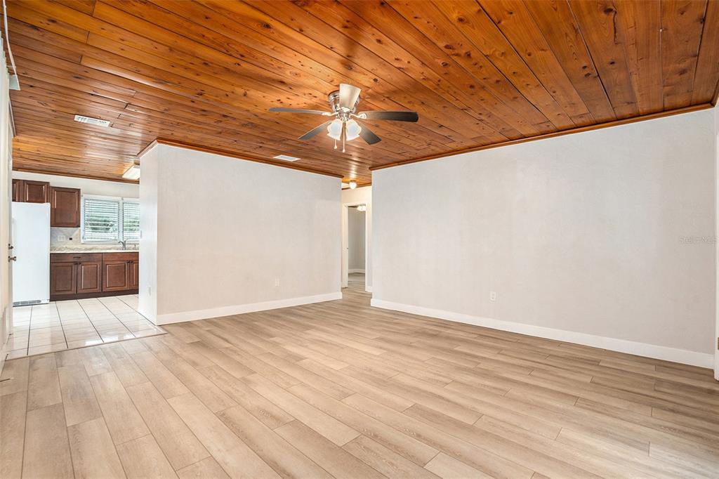 5305 Whiteway Drive Temple Terrace, FL 33617 - Photo 8 of 22 a view of an empty room with wooden floor