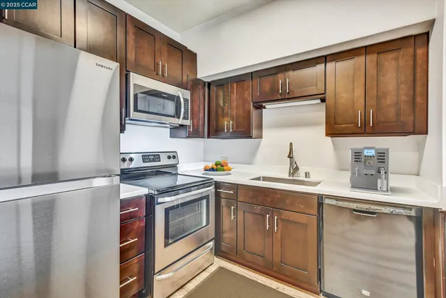 a bathroom with a double vanity sink mirror and toilet