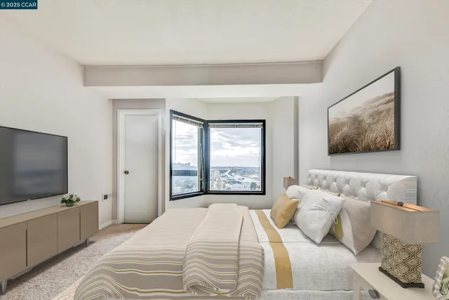 a bedroom with a bed and a flat screen tv