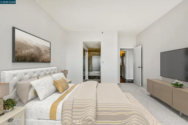a en suite bathroom with double vanity and a mirror