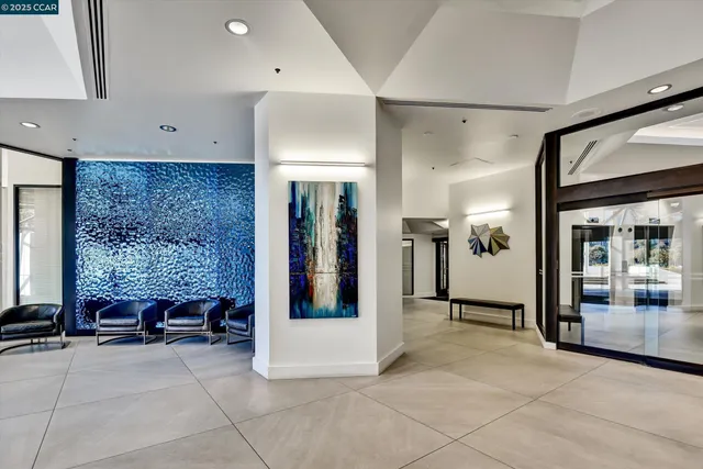 a view of hallway with a door and a rug