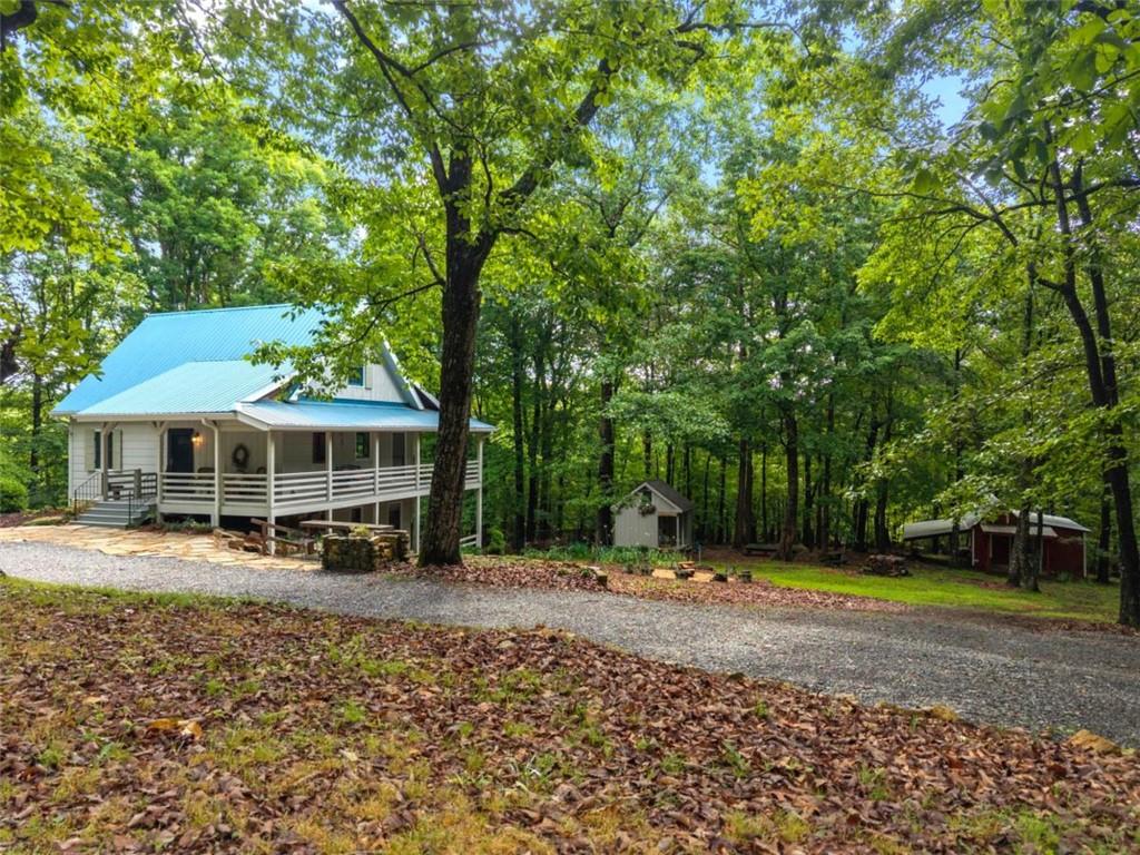 219 Raven Cliff Road Talking Rock, GA 30175 - Photo 1 of 77 a view of a house with a yard