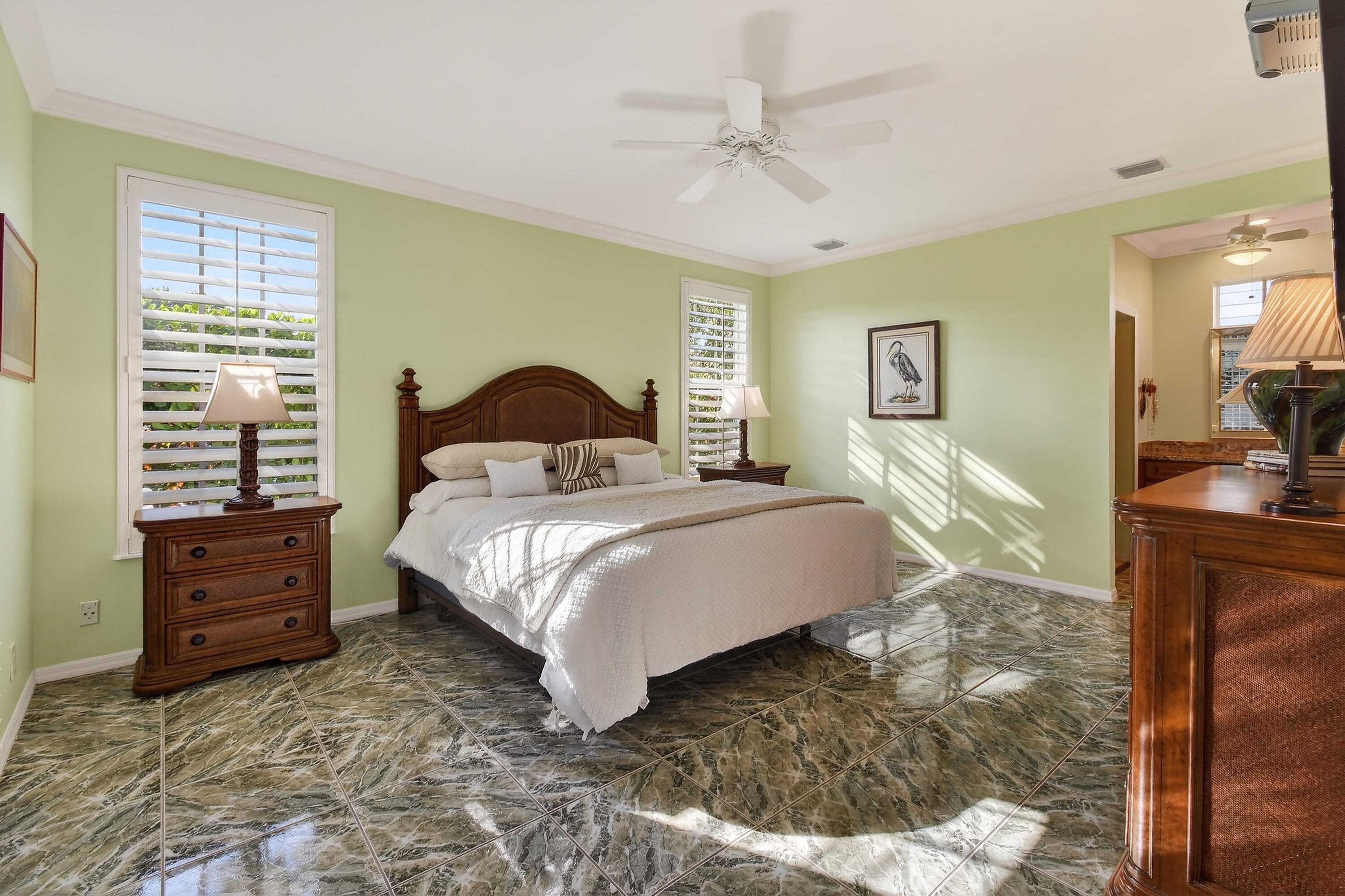 154 Jupiter Key Road Jupiter, FL 33477 - Photo 14 of 64 a bedroom with a large bed and a chandelier