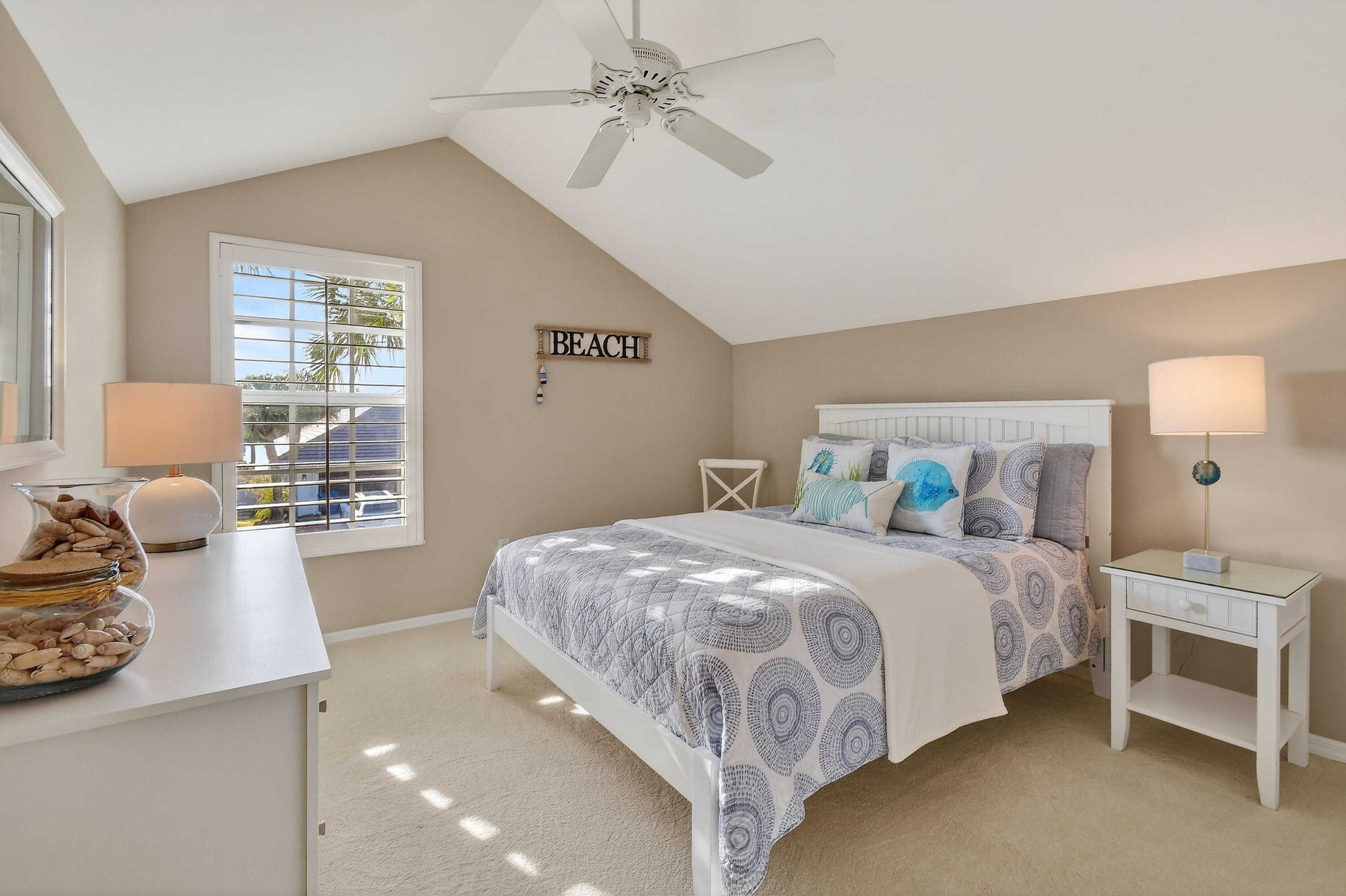 154 Jupiter Key Road Jupiter, FL 33477 - Photo 25 of 64 a bedroom with a bed and window