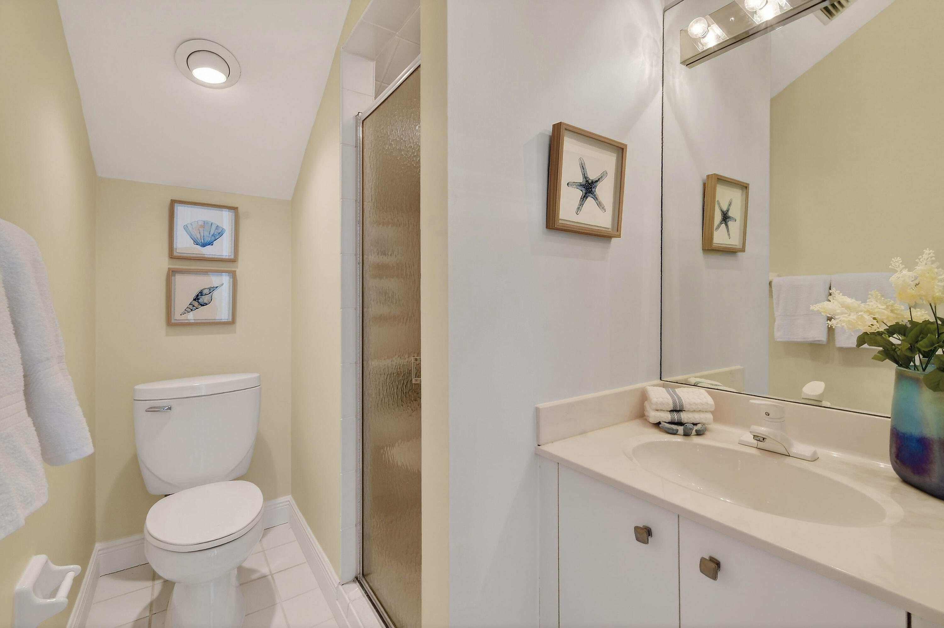 154 Jupiter Key Road Jupiter, FL 33477 - Photo 27 of 64 a bathroom with a toilet sink and mirror