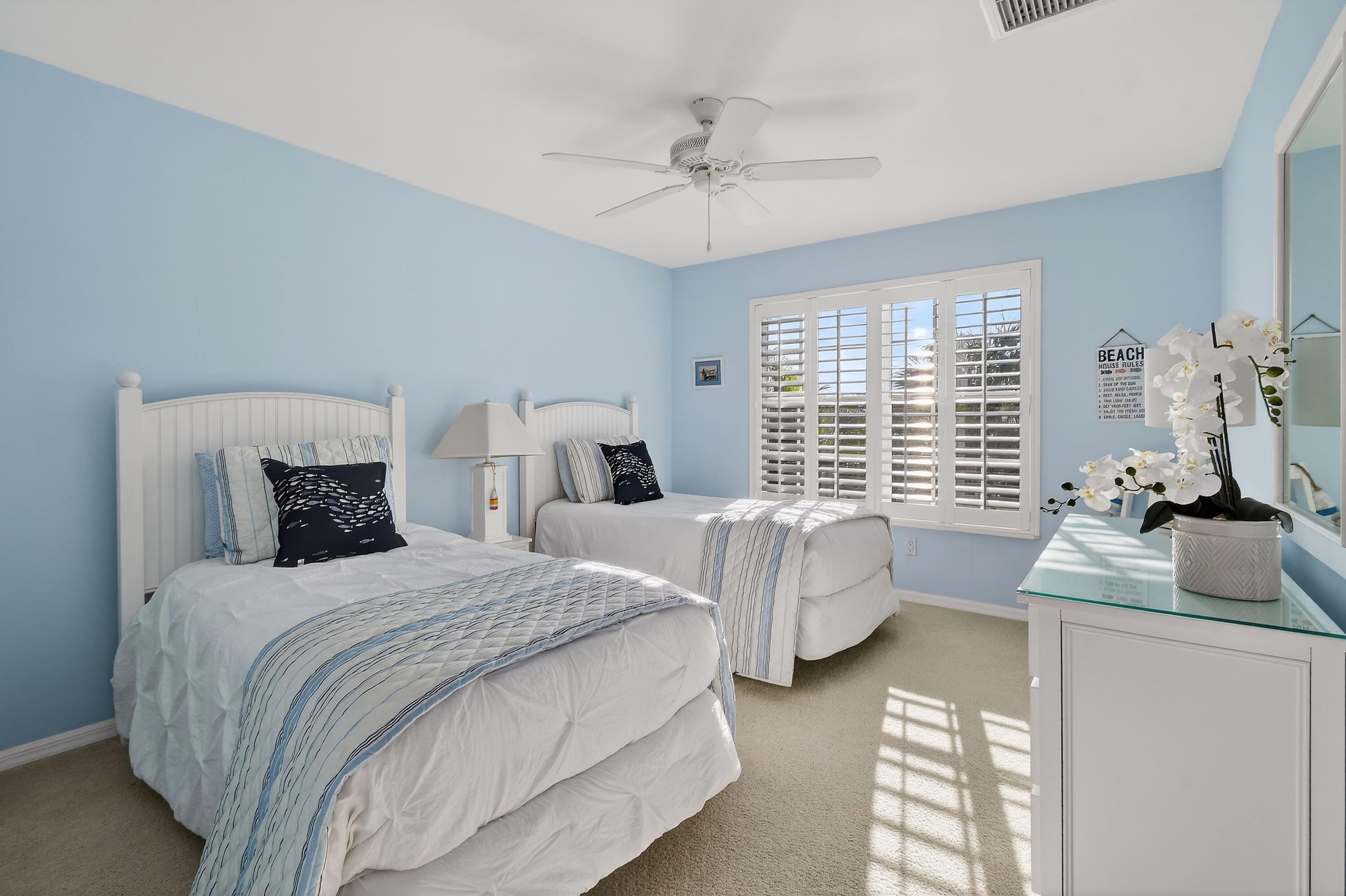 154 Jupiter Key Road Jupiter, FL 33477 - Photo 28 of 64 a bedroom with two beds and a large window