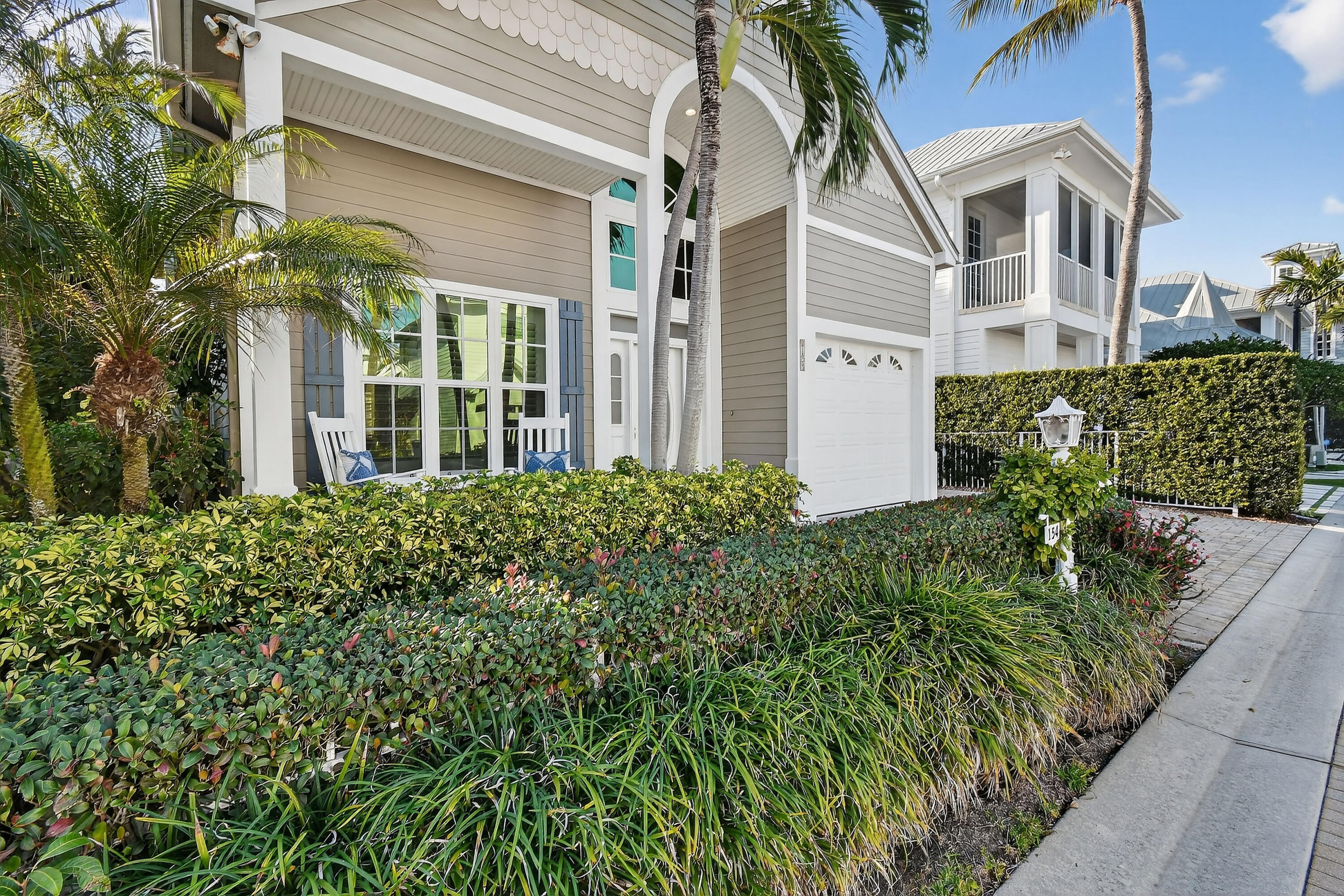 154 Jupiter Key Road Jupiter, FL 33477 - Photo 3 of 64 a view of a building with potted plants