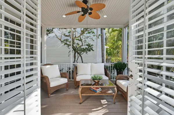 a view of a swimming pool with outdoor seating