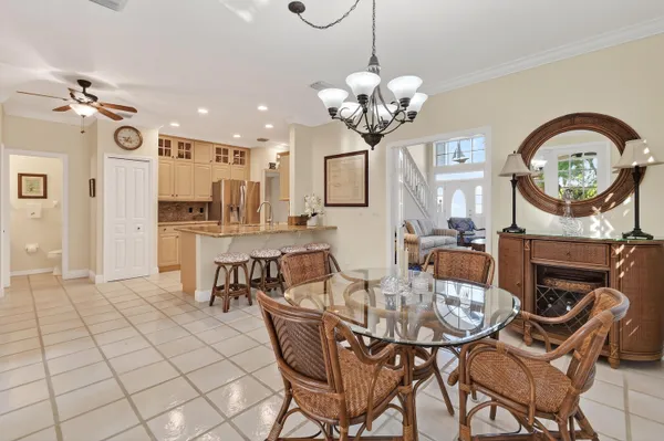 a kitchen with granite countertop white cabinets stainless steel appliances and a sink