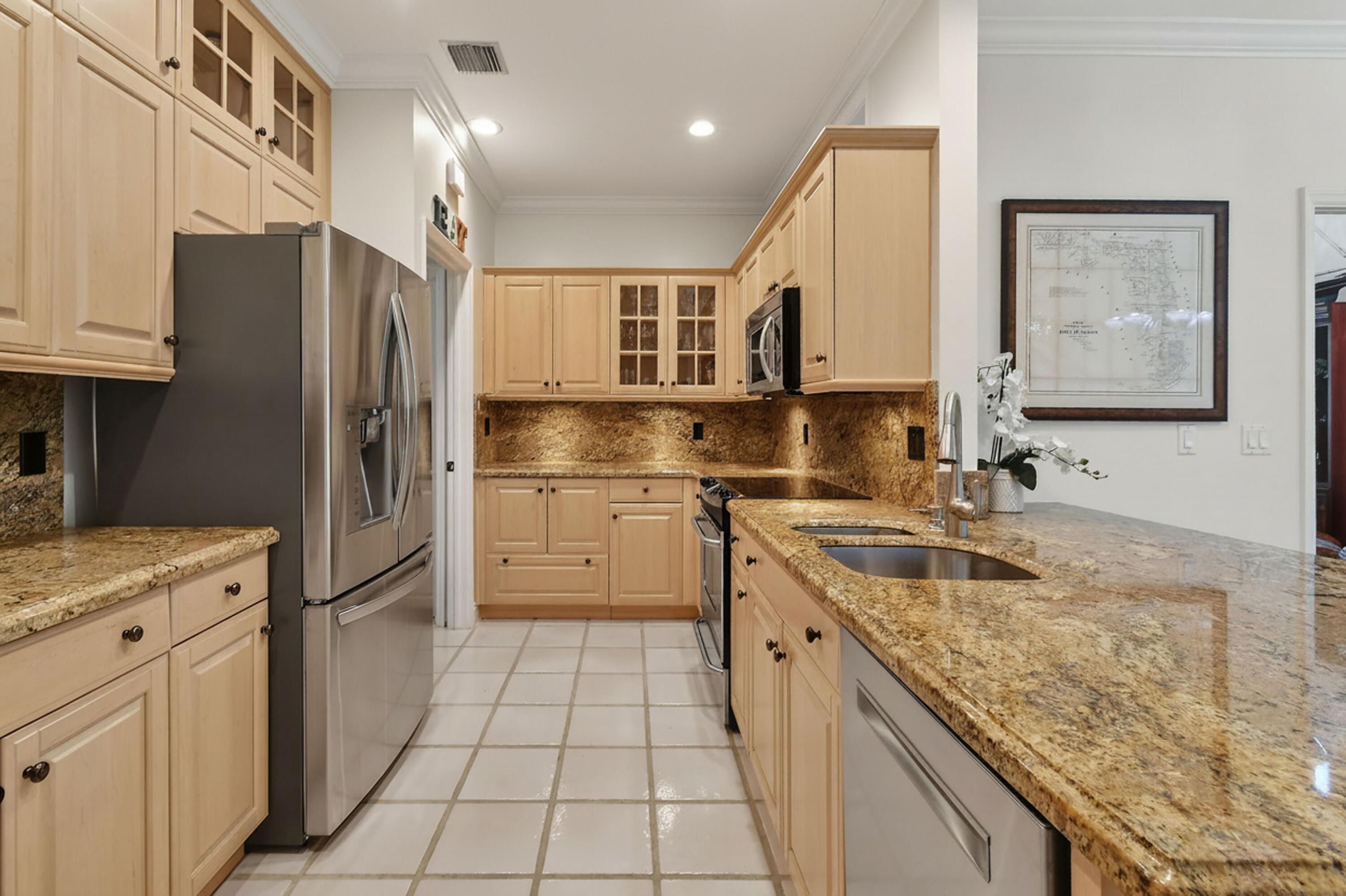 154 Jupiter Key Road Jupiter, FL 33477 - Photo 9 of 64 a kitchen with a sink stove and refrigerator