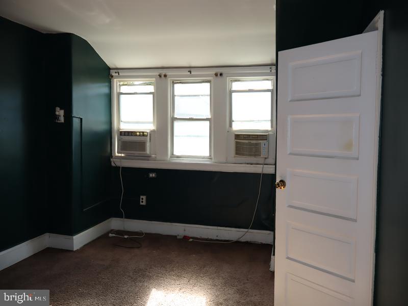 6386 Sherwood Road Philadelphia, PA 19151 - Photo 15 of 18 a view of an empty room with a window