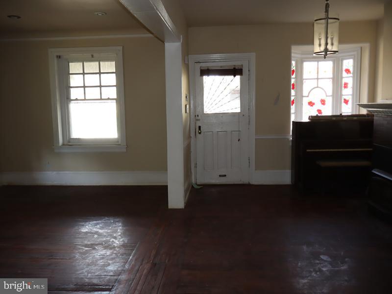 6386 Sherwood Road Philadelphia, PA 19151 - Photo 18 of 18 a view of a livingroom with wooden floor and windows