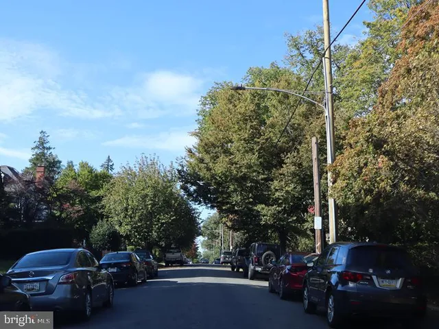 a view of street with parked cars