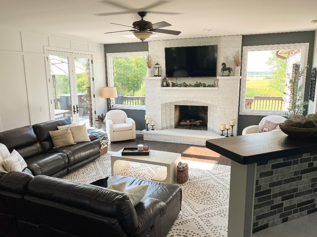 3503 Deep Cut Road Woodstock, IL 60098 - Photo 12 of 34 a living room with furniture a fireplace and a flat screen tv