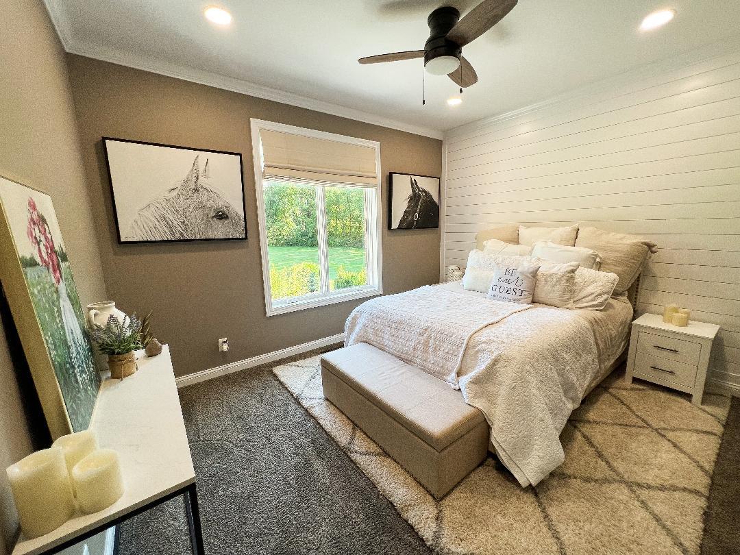 3503 Deep Cut Road Woodstock, IL 60098 - Photo 18 of 34 a bedroom with a large bed and a couch