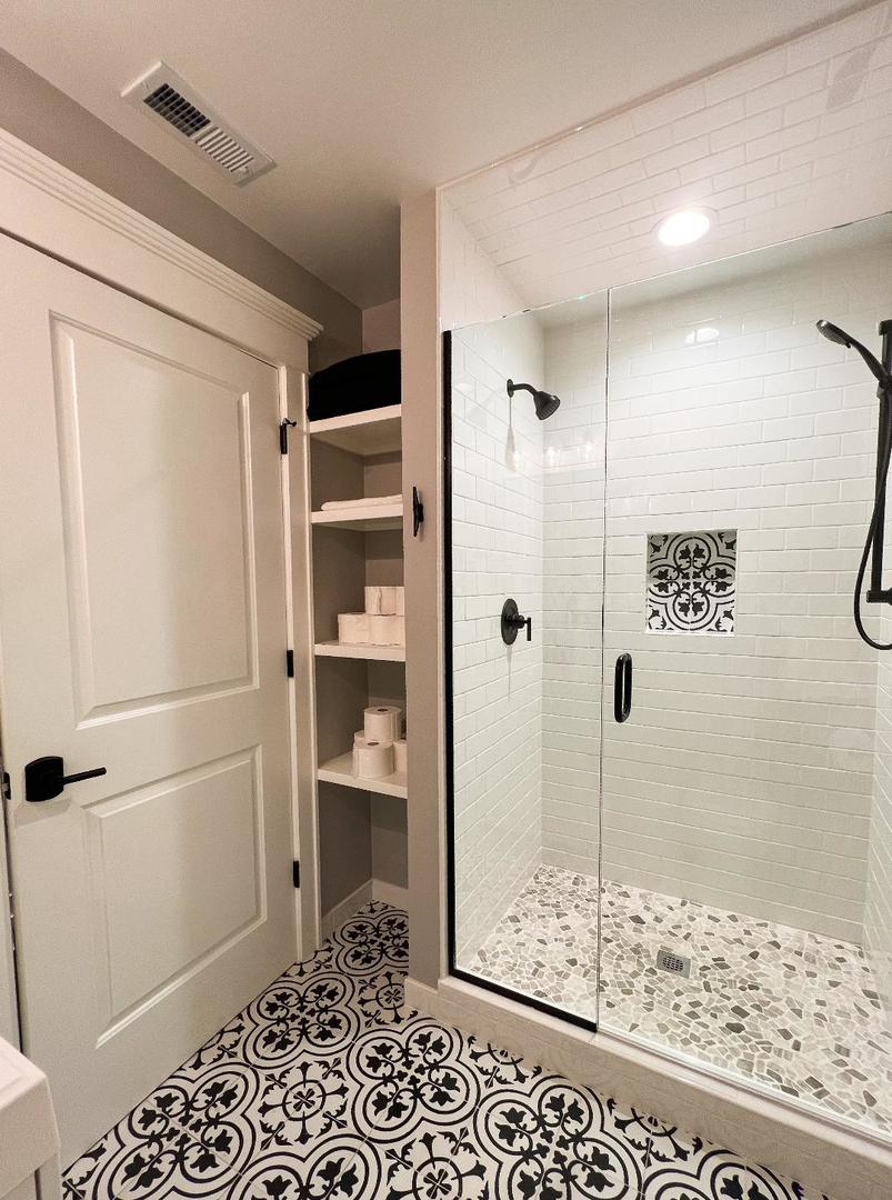 3503 Deep Cut Road Woodstock, IL 60098 - Photo 31 of 34 a bathroom with a shower and a sink