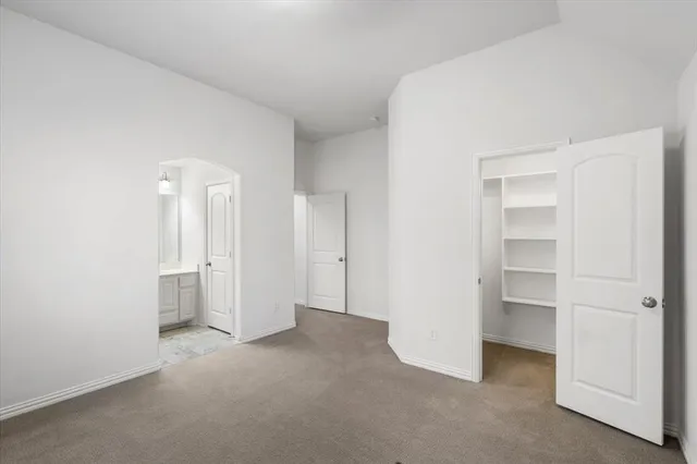 a bathroom with a bathtub a sink a toilet and a mirror