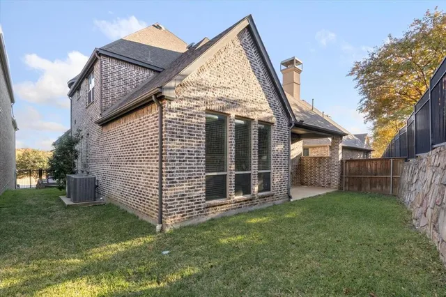 a view of a house with a yard and stairs