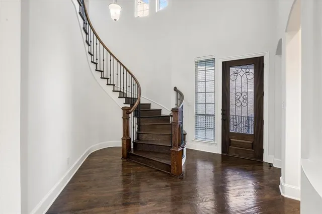 a view of an entryway with wooden floor
