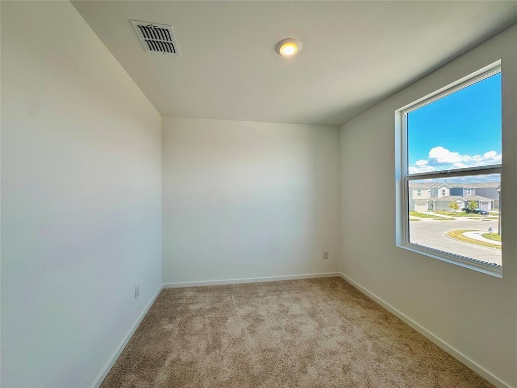 6206 Sanderling Street Princeton, TX 75407 - Photo 11 of 15 an empty room with a window