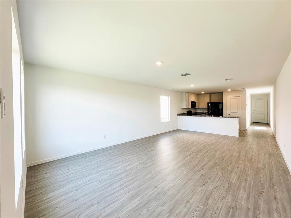 6206 Sanderling Street Princeton, TX 75407 - Photo 4 of 15 a view of a kitchen with a sink and a window