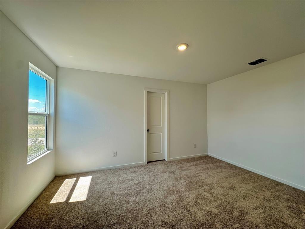 6206 Sanderling Street Princeton, TX 75407 - Photo 6 of 15 a view of an empty room and window