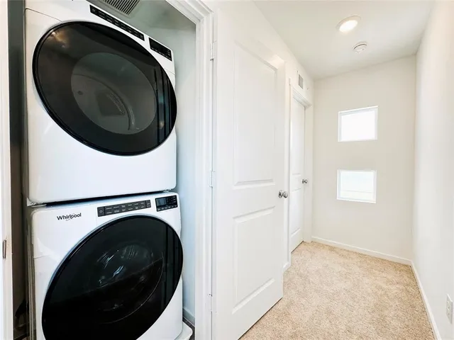 a bathroom with a granite countertop shower a toilet and a sink