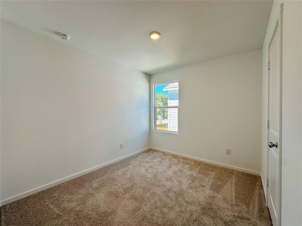 6206 Sanderling Street Princeton, TX 75407 - Photo 9 of 15 an empty room with windows