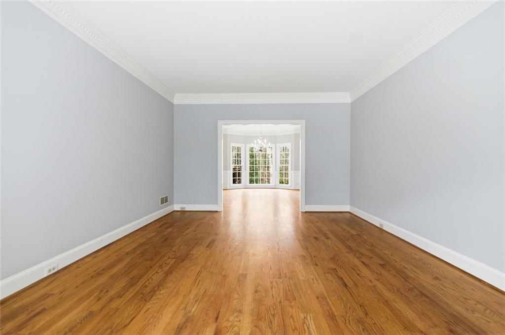3463 Buck Hill Road Marietta, GA 30067 - Photo 15 of 82 wooden floor in an empty room with a window