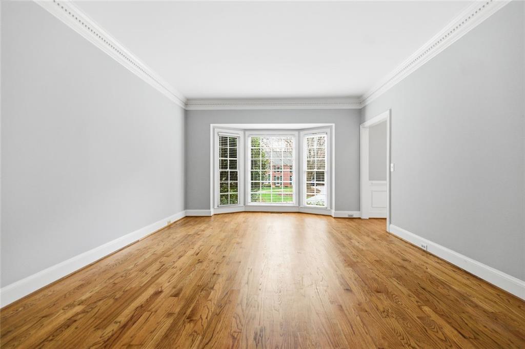 3463 Buck Hill Road Marietta, GA 30067 - Photo 17 of 82 wooden floor in an empty room with a window