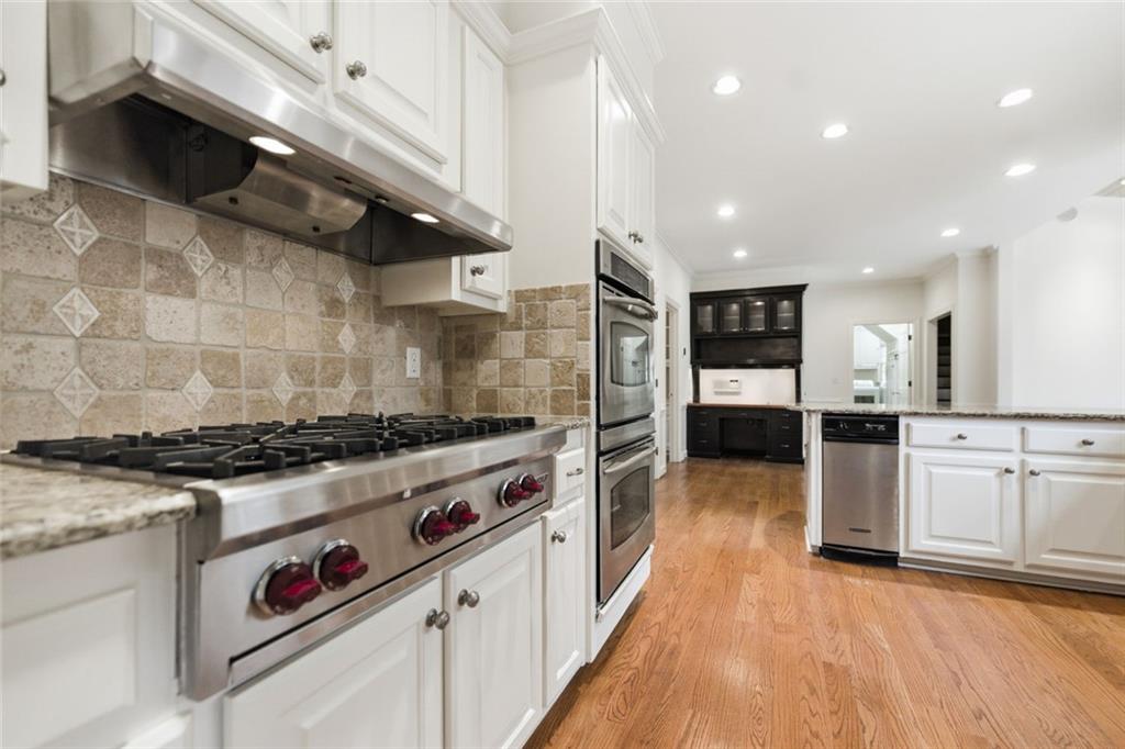 3463 Buck Hill Road Marietta, GA 30067 - Photo 20 of 82 a kitchen with stainless steel appliances granite countertop a stove and a refrigerator