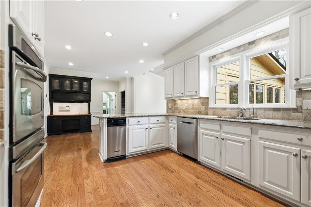 3463 Buck Hill Road Marietta, GA 30067 - Photo 21 of 82 a kitchen with stainless steel appliances granite countertop a stove top oven a sink and a granite counter tops