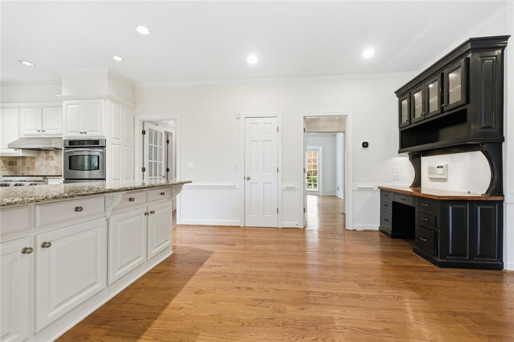 3463 Buck Hill Road Marietta, GA 30067 - Photo 26 of 82 a large kitchen with stainless steel appliances granite countertop a stove a sink and a microwave