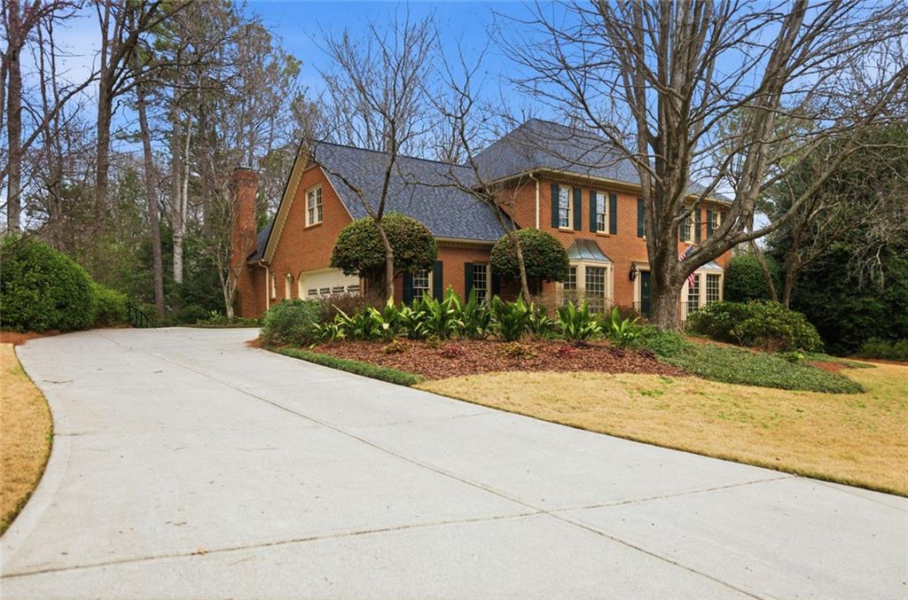 3463 Buck Hill Road Marietta, GA 30067 - Photo 3 of 82 a front view of house with yard and trees around