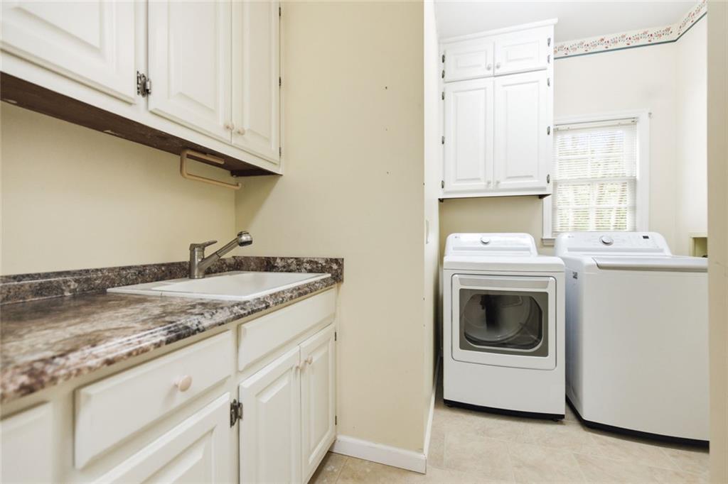 3463 Buck Hill Road Marietta, GA 30067 - Photo 37 of 82 a utility room with sink dryer and washer