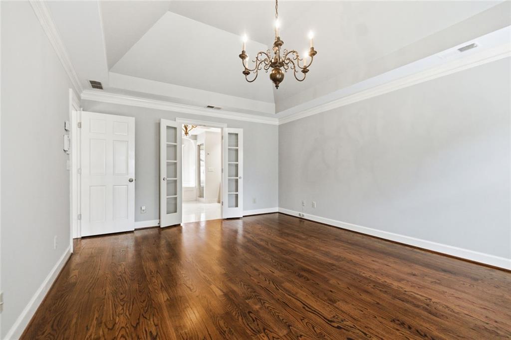 3463 Buck Hill Road Marietta, GA 30067 - Photo 42 of 82 a view of an empty room with wooden floor and a window