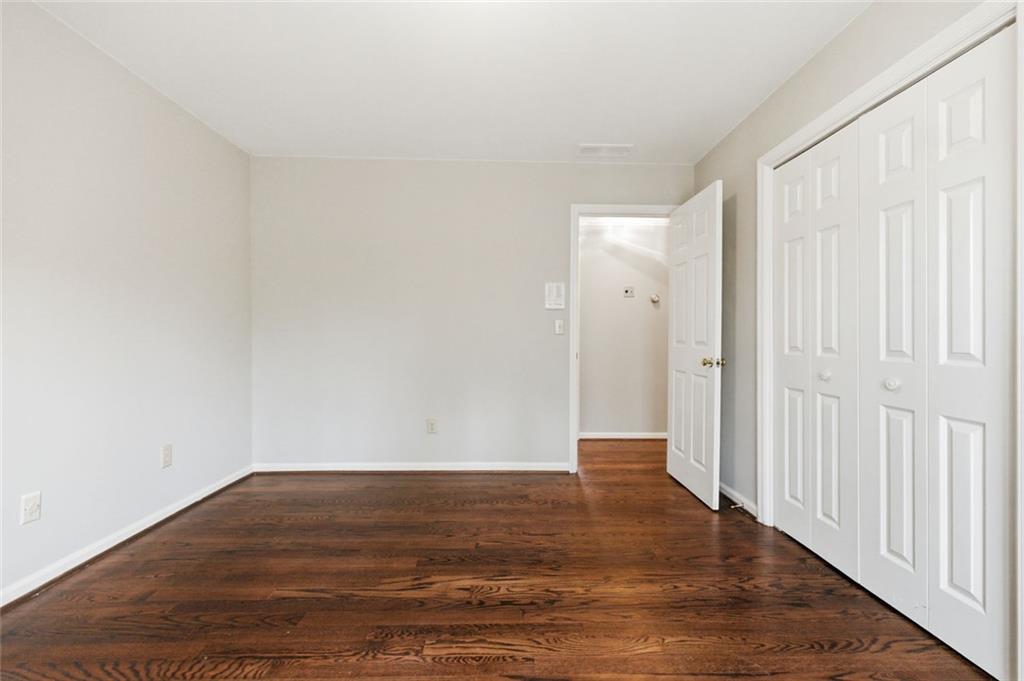 3463 Buck Hill Road Marietta, GA 30067 - Photo 57 of 82 a view of an empty room with wooden floor