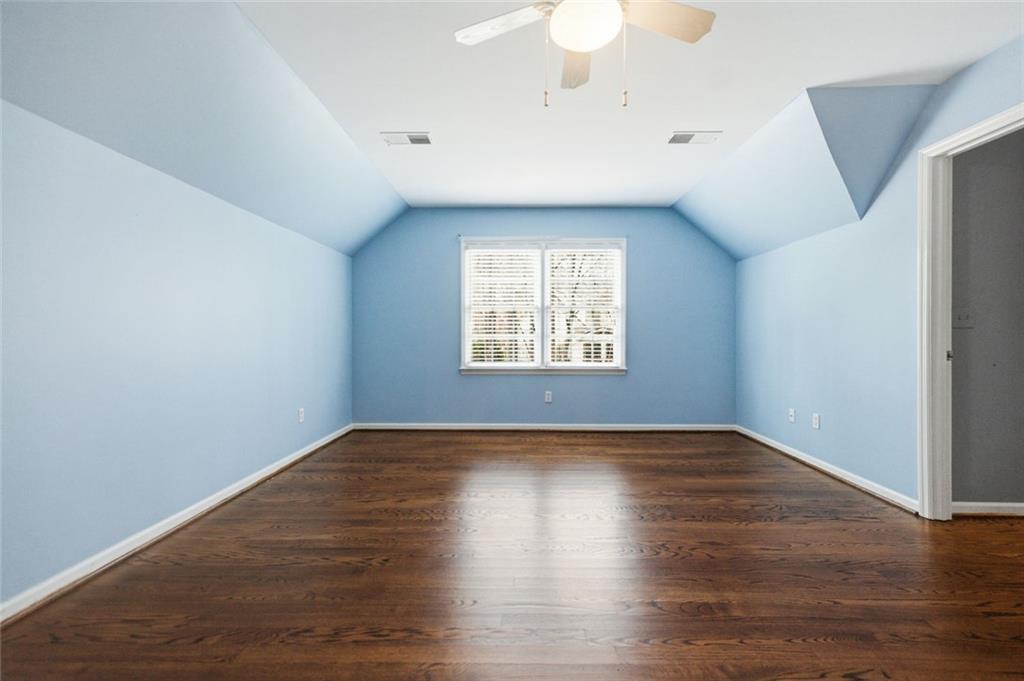 3463 Buck Hill Road Marietta, GA 30067 - Photo 60 of 82 a view of an empty room with wooden floor and a window