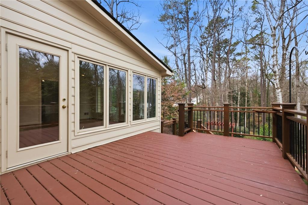 3463 Buck Hill Road Marietta, GA 30067 - Photo 69 of 82 a view of a balcony with wooden floor and floor to ceiling window