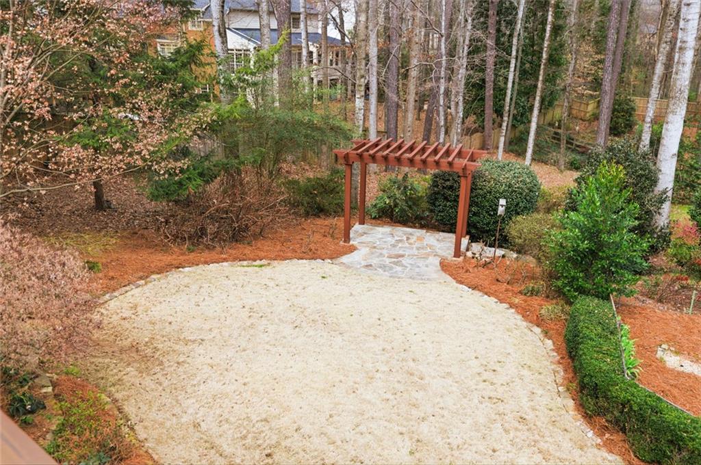 3463 Buck Hill Road Marietta, GA 30067 - Photo 73 of 82 a view of a backyard with plants and trees