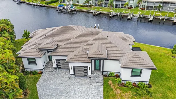 a front view of a house with outdoor seating