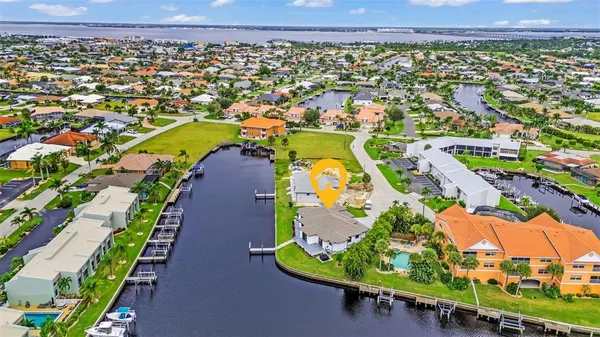 an aerial view of a house with a swimming pool