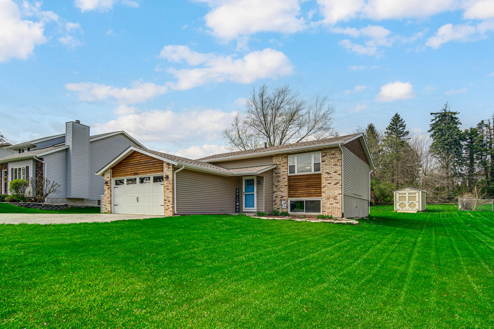 3113 Devonshire Circle Crown Point, IN 46307 - Photo 2 of 18 a front view of house with yard and green space